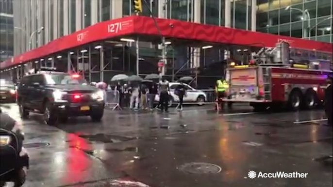 Fire engines and police vehicles pass through New York streets following helicopter crash