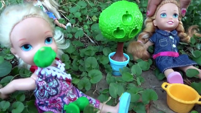 Elsa and Anna toddlers flowers and gardening