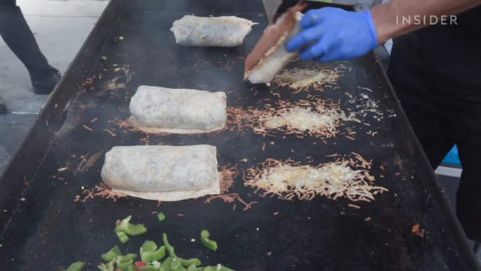 These breakfast burritos are wrapped in a cheese blanket.