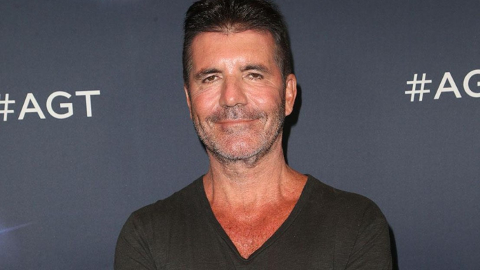 Simon Cowell happy for Kelly Clarkson