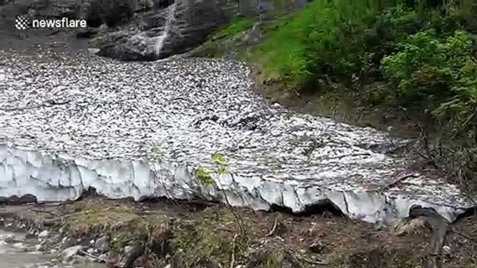 Avalanches and rivers form unusual 'ice chapel' below Austrian mountains