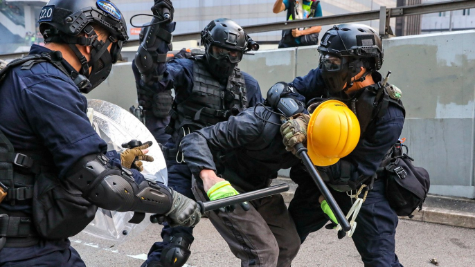 Tear gas, petrol bombs and mass arrests on 17th straight Sunday of anti-government protests in Hong Kong