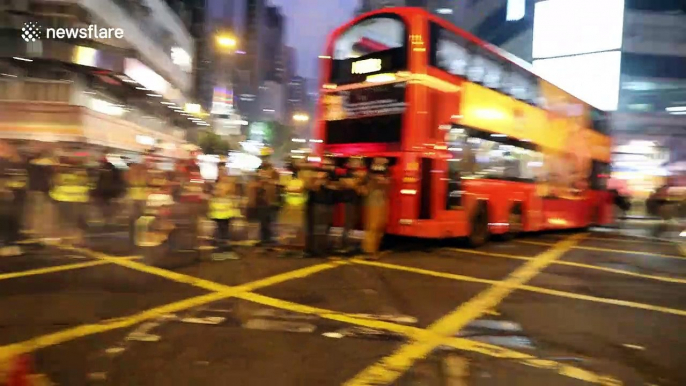 Riot police in Hong Kong fire tear gas in latest clashes with anti-government protesters