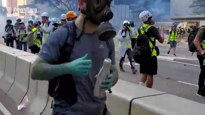 First clashes between Hong Kong protesters and riot police on China's National Day