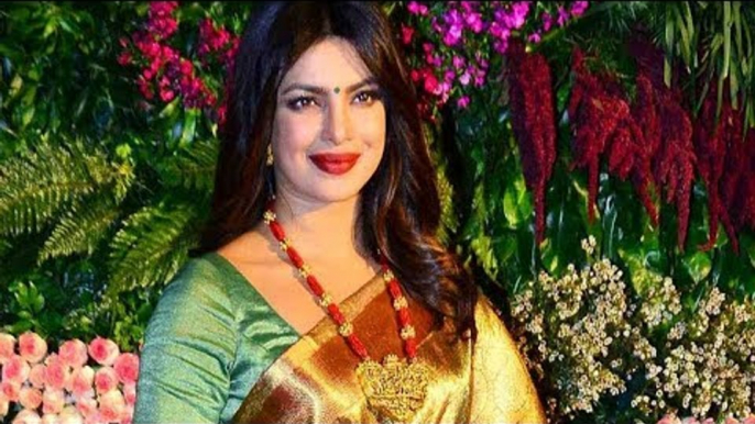 Priyanka Chopra Poses for Shutterbugs at Anushka Virat Reception | SpotboyE