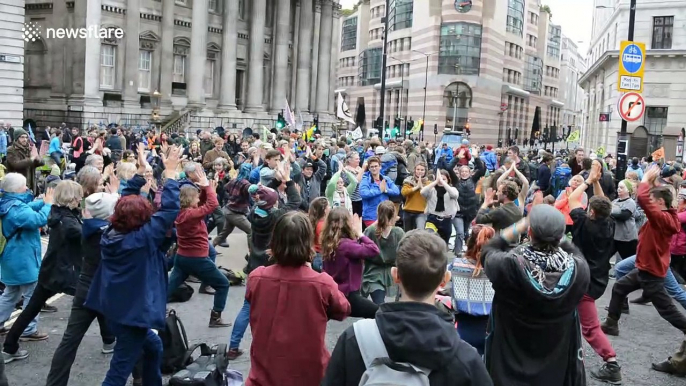 Extinction Rebellion protesters do yoga as second week of protests begin