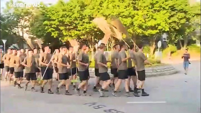 China sends troops onto Hong Kong's street's to clean up after protests