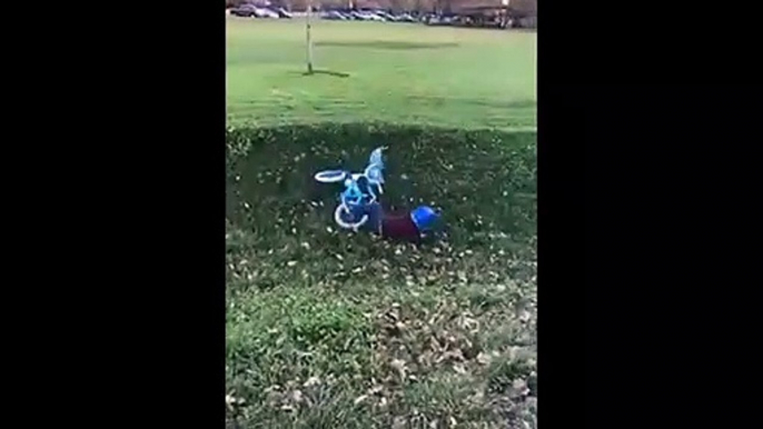 Kid Tries To Ride His Bike Up A Hill And Falls