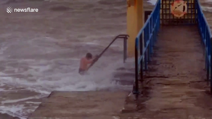 'Nice day for a dip': Man goes swimming off Irish coast during Storm Brendan