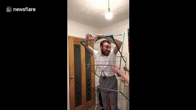 Hilarious moment man gets stuck in clothing rack in hilarious TikTok gone wrong