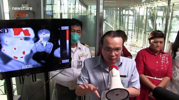 Thai airport screens passengers for coronavirus as country confirms fifth case of the illness