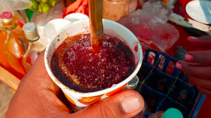 Ice Gola, Kala Khatta chuski, barf ka gola at Juhu Beach Mumbai , India