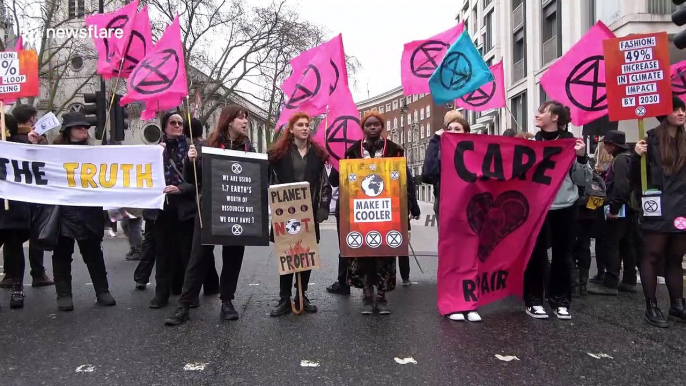 Extinction Rebellion protesters block roads around London Fashion Week venue