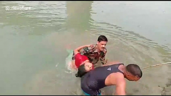 Brave soldier in India dives into river to rescue drowning woman