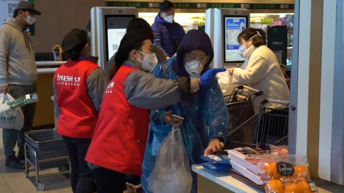 Chinese supermarkets battle to stay open during the coronavirus epidemic