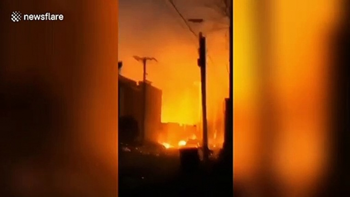 Huge fire spreads in strong winds, burning several vehicles in northern China