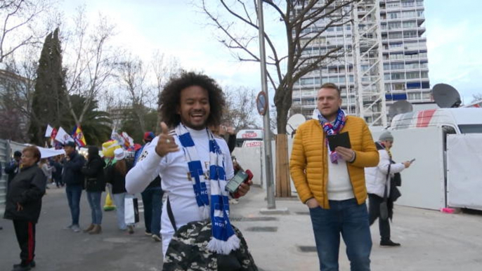 Excited Madrid and Barca fans arrive at the Bernabeu for El Clasico