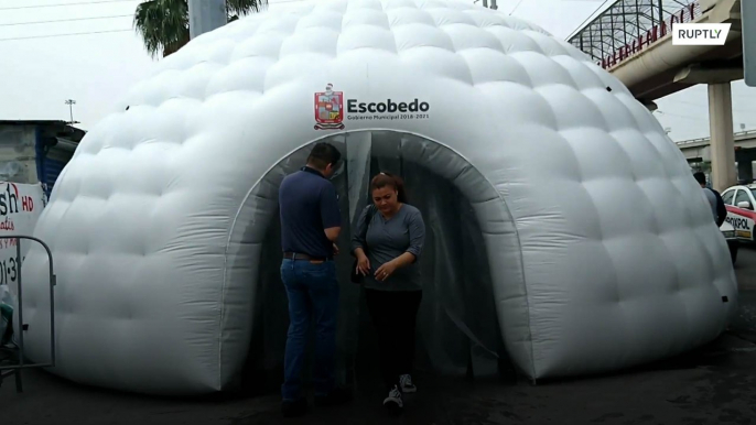 Inflatable disinfection tunnels set up outside metro stations to curb COVID-19 spread