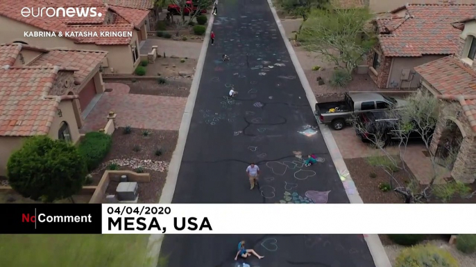 Spreading the love: Sisters cover road with hearts to lift spirits amid coronavirus pandemic