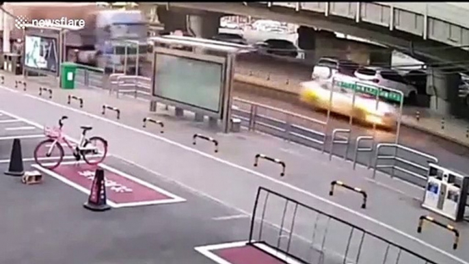 Sinkhole opens up on Chinese road after transport truck drives over it seeing tyre explosion