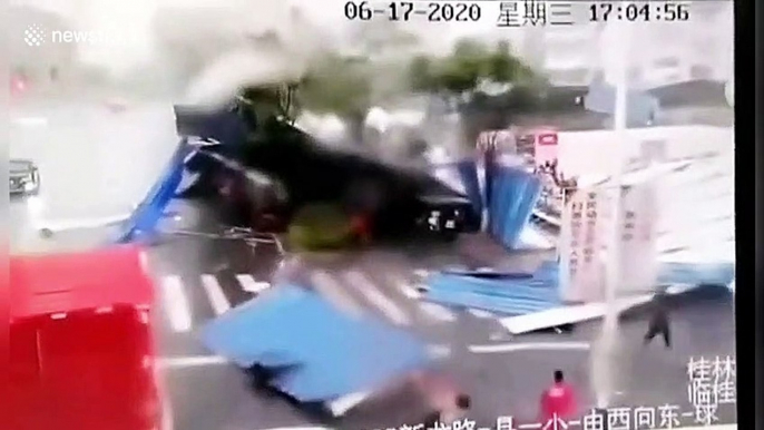 Strong winds rip off canopy seeing it slam down onto pedestrians and vehicles in southern China