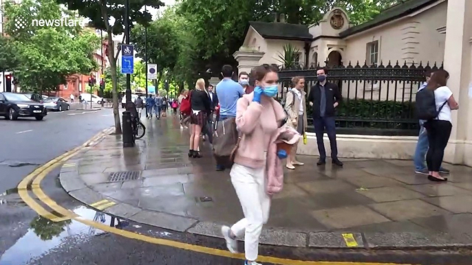 Russian citizens in London queue to get inside embassy for constitution vote