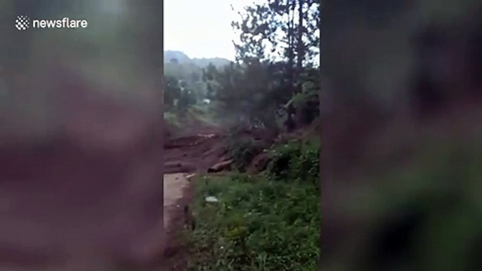 Landslide sweeps through village in the Philippines after heavy rain