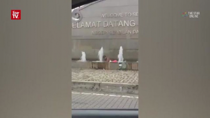 Man skinny dips in public fountain