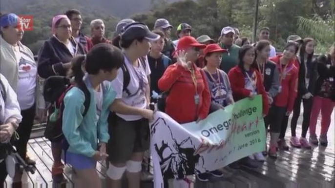 Families climb Mount Kinabalu to commemorate earthquake victims