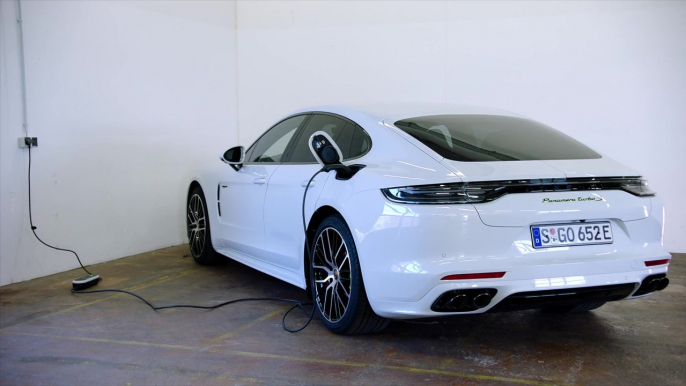 The new Porsche Panamera Turbo S E-Hybrid in Carrara White Charging