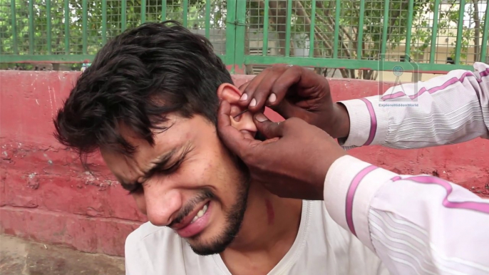 Roadside Ear wax cleaner : Painful way to remove dirt and gunk with a needle ??