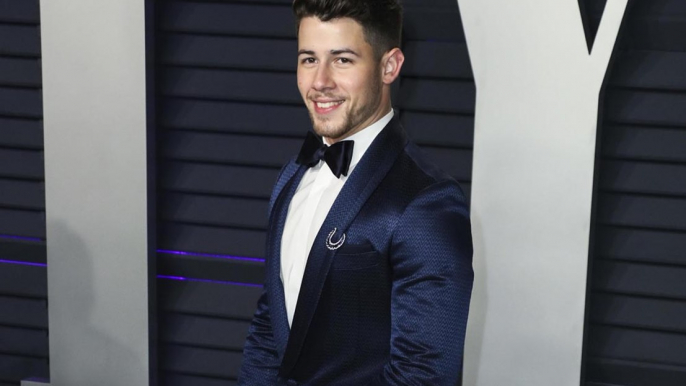 Nick Jonas insists the Jonas Brothers are 'still a band'