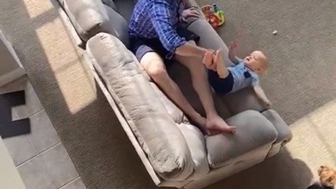 Dad Catches Baby's Leg While Saving Him From Falling Off Couch