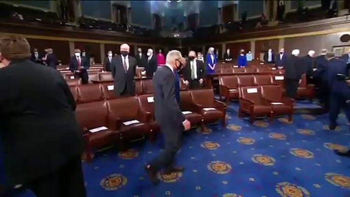 Kamala Harris and Nancy Pelosi take their place behind the podium for President Biden's speech