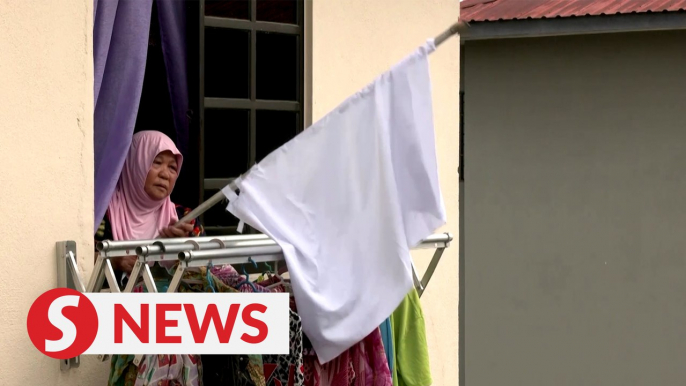 Malaysians hoist white flags for help in lockdown