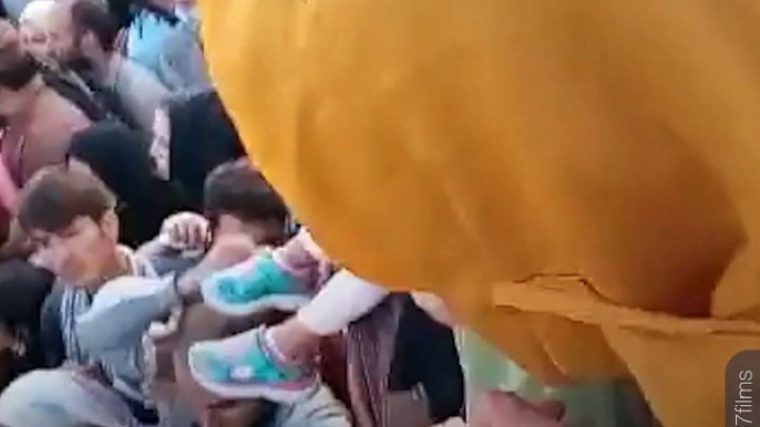 Afghan Parents Pass Babies To Troops Over Walls In Desperate Attempt To Escape