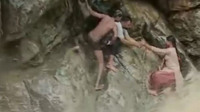 Image of the day: Villagers rescue woman, child from flash flood in Tamil Nadu