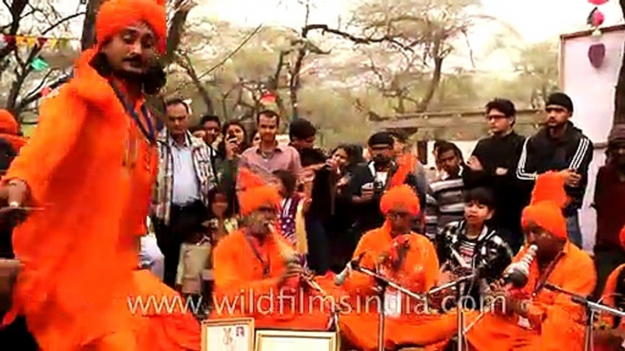 Man dancing to a Snake charmer's tune at Surajkund mela