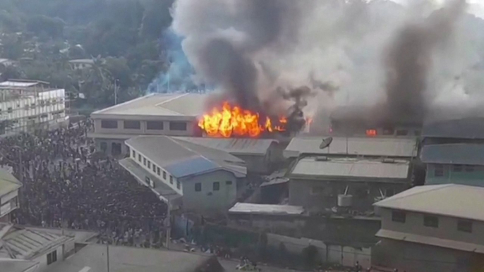 Solomon Islands riot sets Chinatown ablaze in capital Honiara as protests turn violent