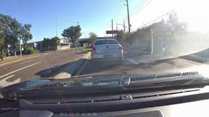 Distracted Driver Nearly Crashes