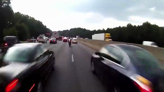 A Motorcycle Rider Pays The Price For Lane Splitting And Ends Up Crashing Into A Vehicle