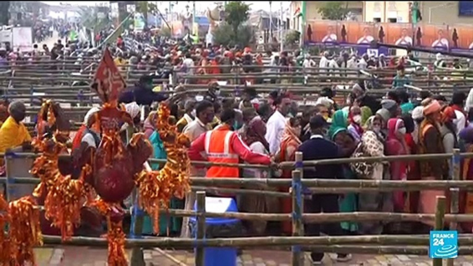 Hundreds of thousands of Indians gather for holy dip, defying Covid-19 surge