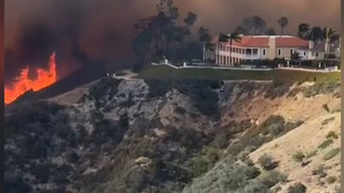 Watch as rapidly moving brushfire engulfs homes in flames