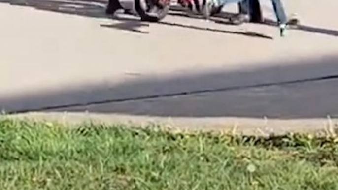 Neighborhood Kids Teach Young Boy to Ride Bike