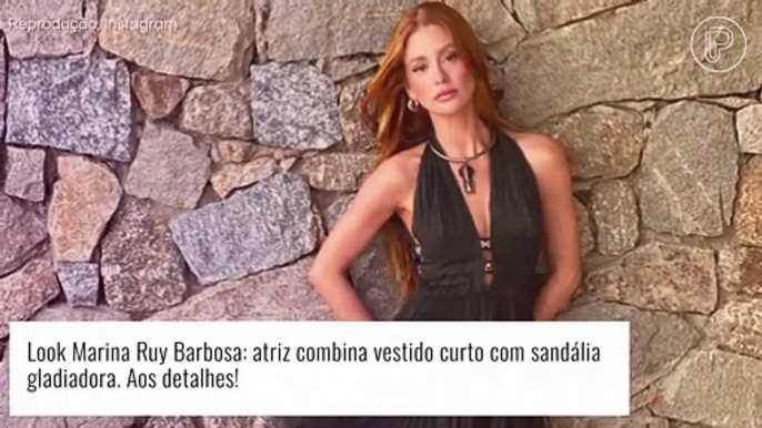 Marina Ruy Barbosa combina vestido preto curto com renda e sandália gladiadora em look. Detalhes!