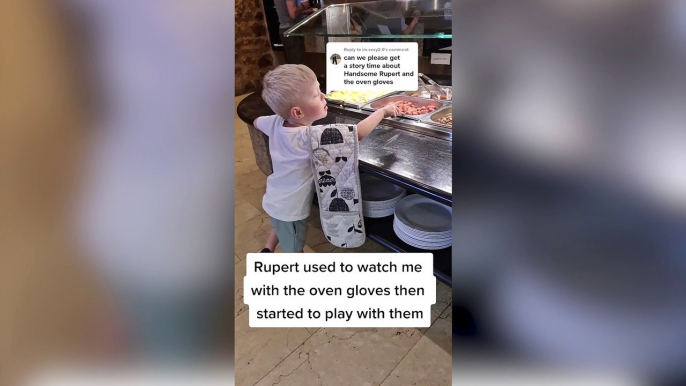 Little boy obsessed with his mum's oven gloves