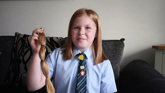 Young girl donates long hair to charity