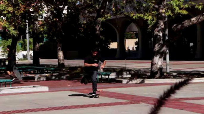 Skateboarder does trick down set of stairs then board bounces back and hits his face