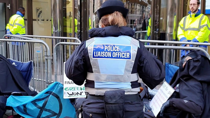 Extiction Rebellion Scotland protest outside JP Morgan in Glasgow