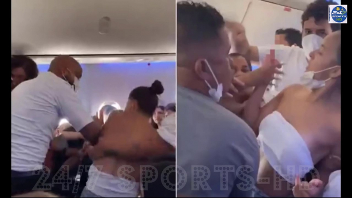 Shocking moment mass brawl between women breaks out on airline jet: Female passengers pull hair, slap each other and even spill out of their clothes as air crew try to calm them down on flight to Brazil